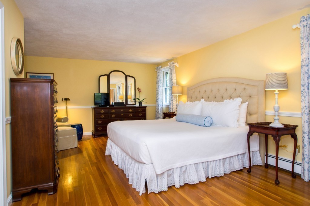 21 Lee Road Medfield, MA 02052 - Photo 14 of 30 a bedroom with a bed and wooden floor