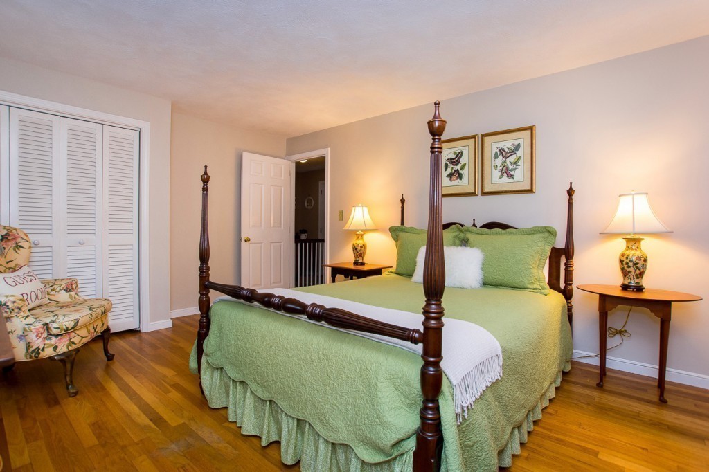 21 Lee Road Medfield, MA 02052 - Photo 18 of 30 a bedroom with a bed and wooden floor