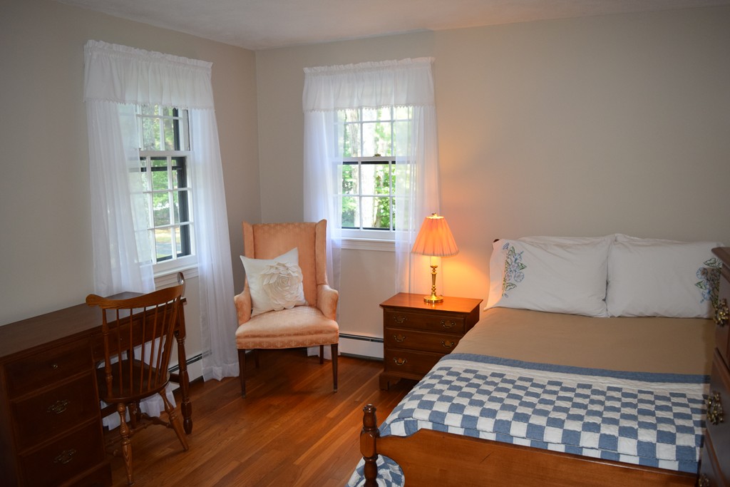 21 Lee Road Medfield, MA 02052 - Photo 19 of 30 a bedroom with a bed and wooden floor