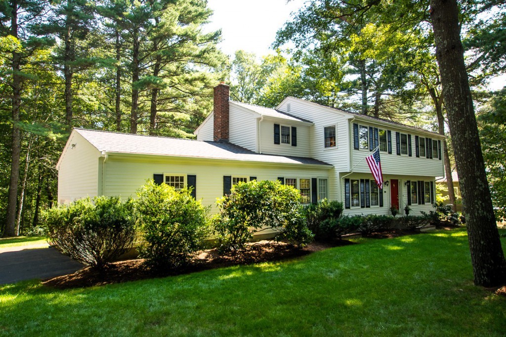 21 Lee Road Medfield, MA 02052 - Photo 2 of 30 a front view of a house with a garden