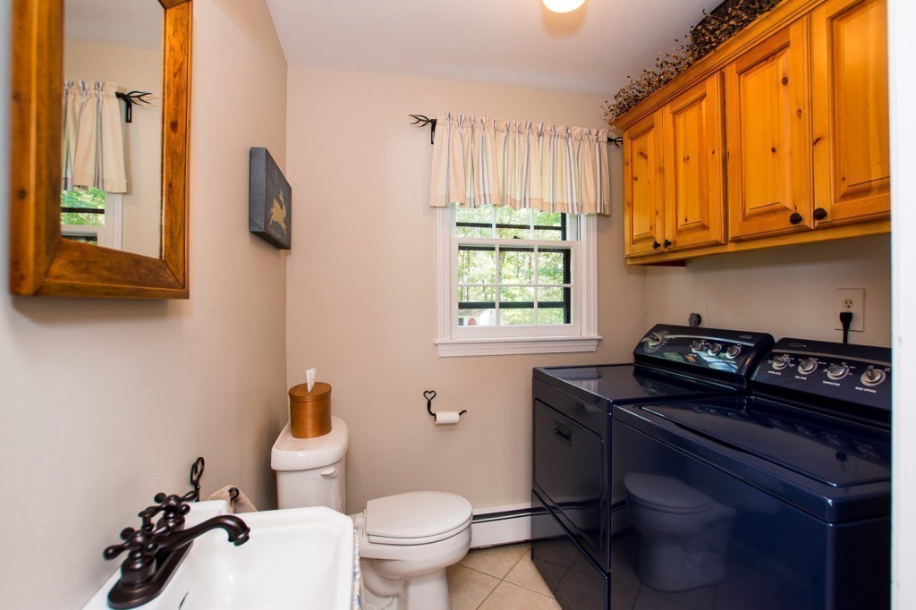 21 Lee Road Medfield, MA 02052 - Photo 22 of 30 a bathroom with a granite countertop toilet sink and mirror