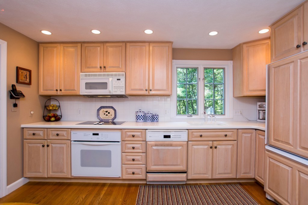 21 Lee Road Medfield, MA 02052 - Photo 4 of 30 a kitchen with stainless steel appliances granite countertop a stove a sink and white cabinets