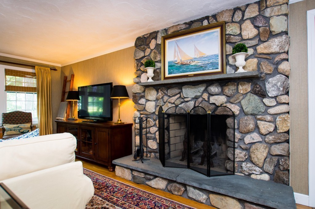 21 Lee Road Medfield, MA 02052 - Photo 6 of 30 a living room with furniture a flat screen tv and a fireplace