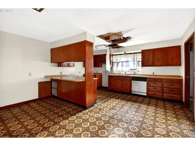 a kitchen with stainless steel appliances kitchen island granite countertop a sink and cabinets