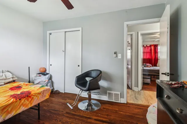 a bedroom with furniture and a window