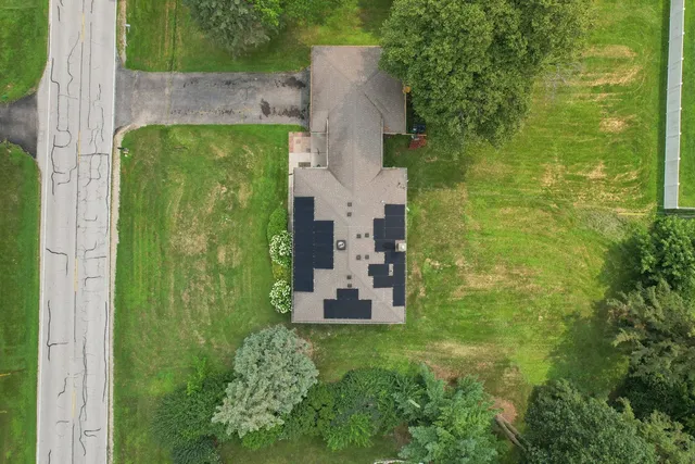 an aerial view of a house with a garden