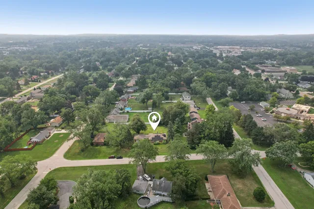 an aerial view of residential building and green space