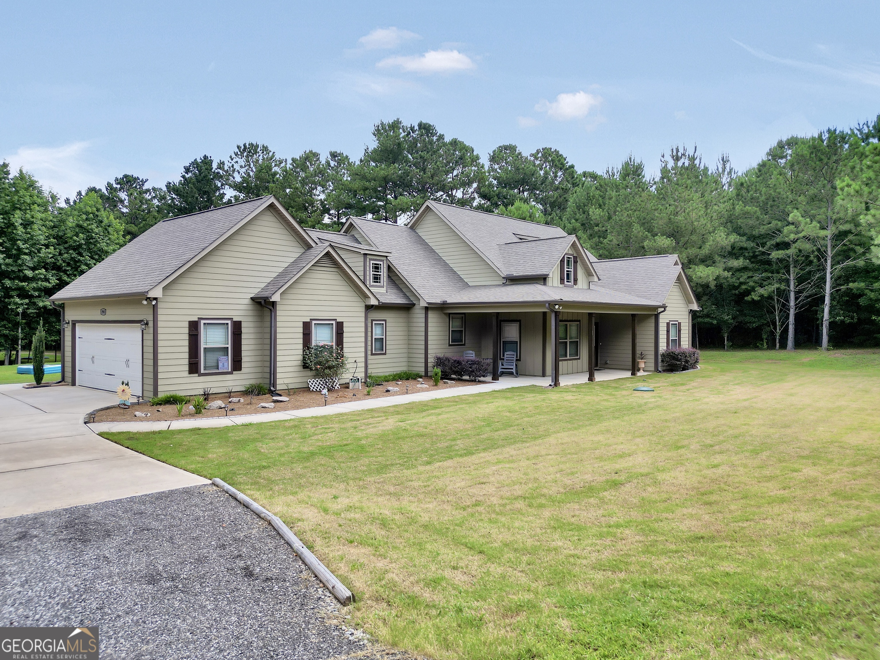 2985 Teamon Road Griffin, GA 30223 - Photo 8 of 50 a front view of a house with garden