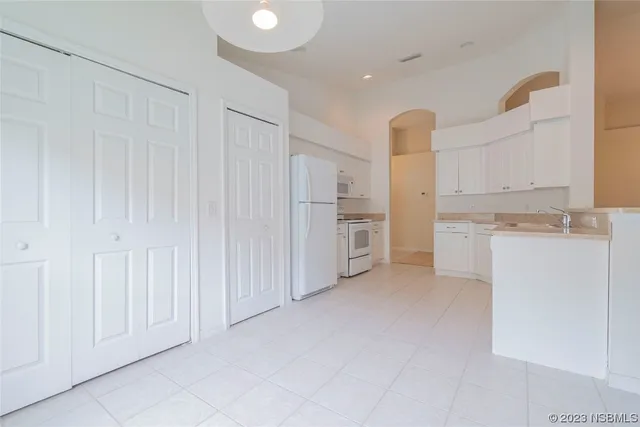 a view of a lake with a building in the background