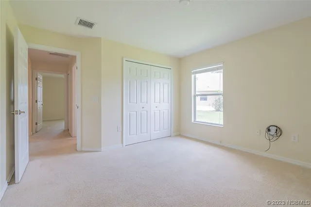 an aerial view of a house with a lake view