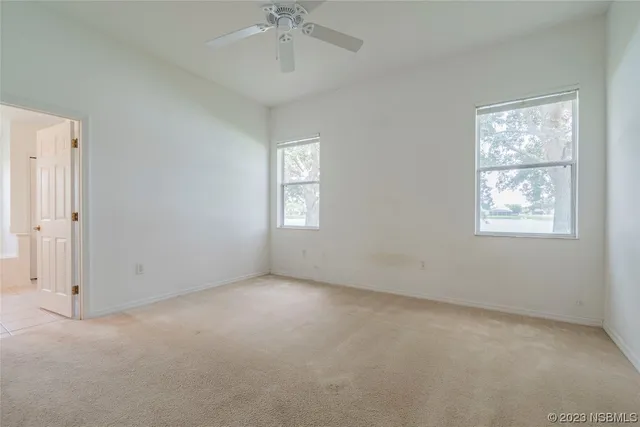 a view of a house with a yard and a street
