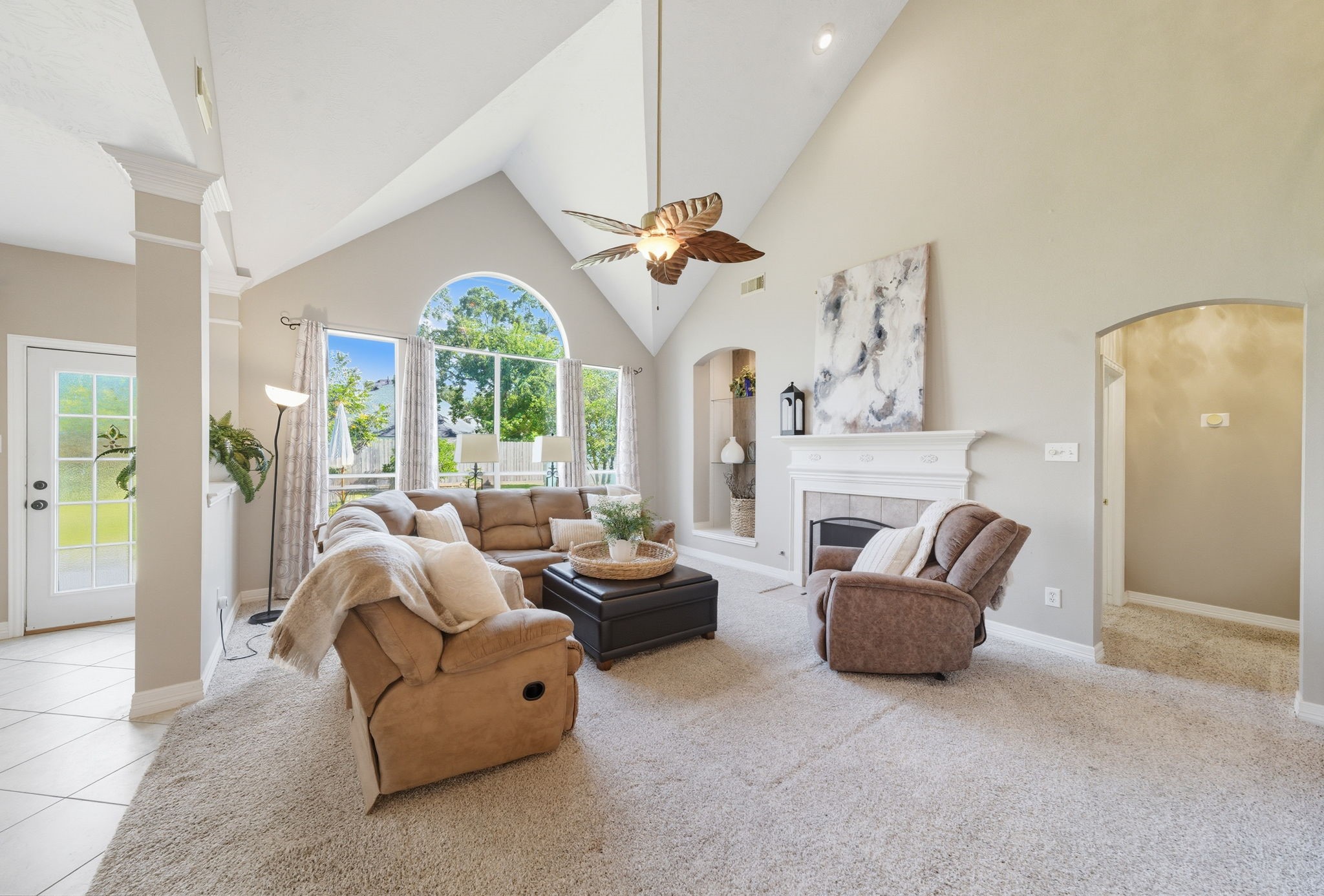 2302 Palm Circle Seabrook, TX 77586 - Photo 12 of 35 a living room with furniture a chandelier and a large window