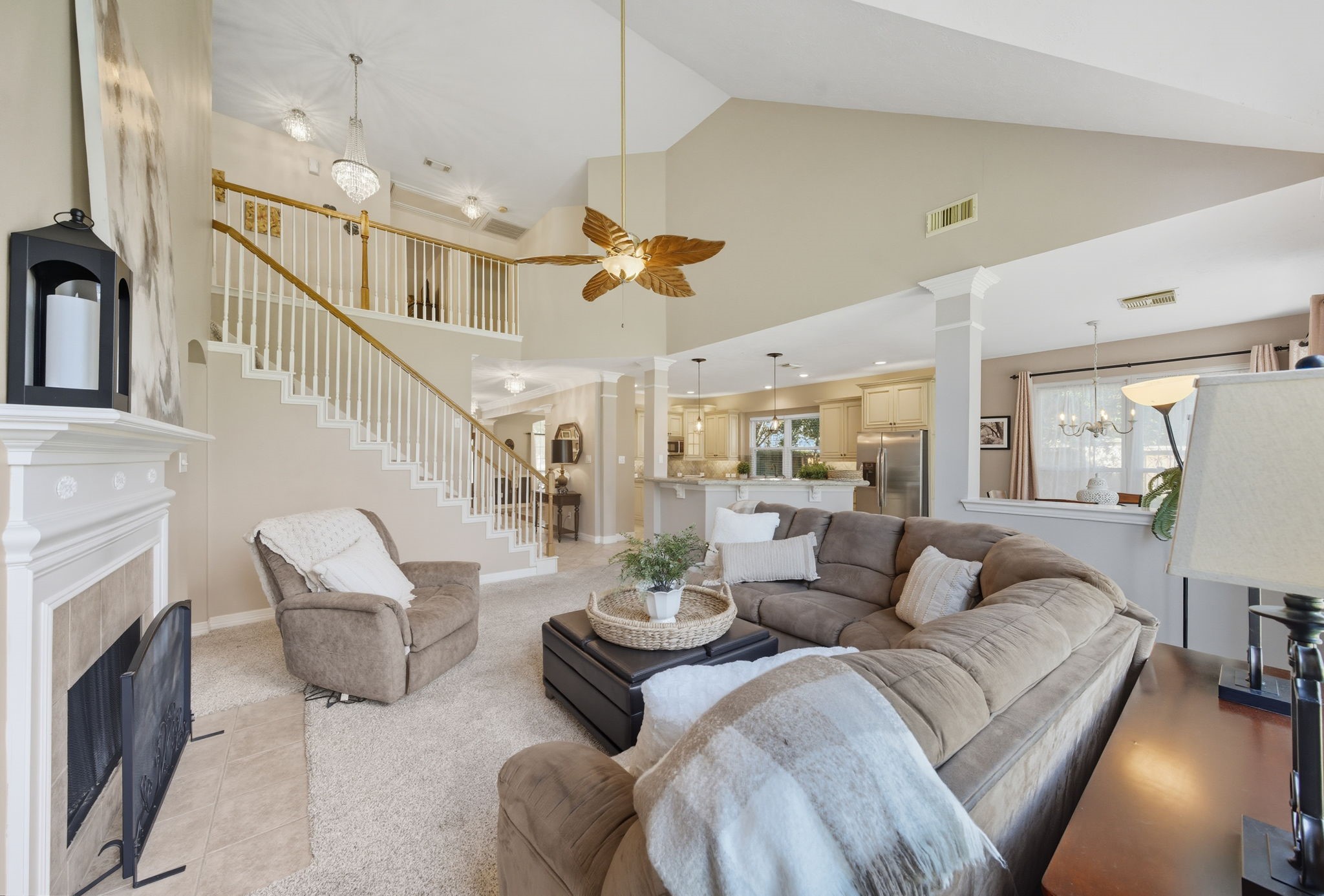 2302 Palm Circle Seabrook, TX 77586 - Photo 14 of 35 a living room with furniture a fireplace and a chandelier