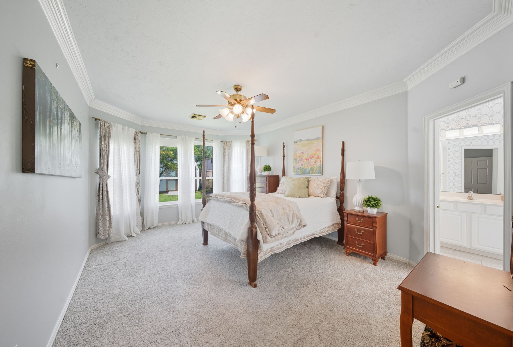 2302 Palm Circle Seabrook, TX 77586 - Photo 16 of 35 a bed room with a bed and a chandelier