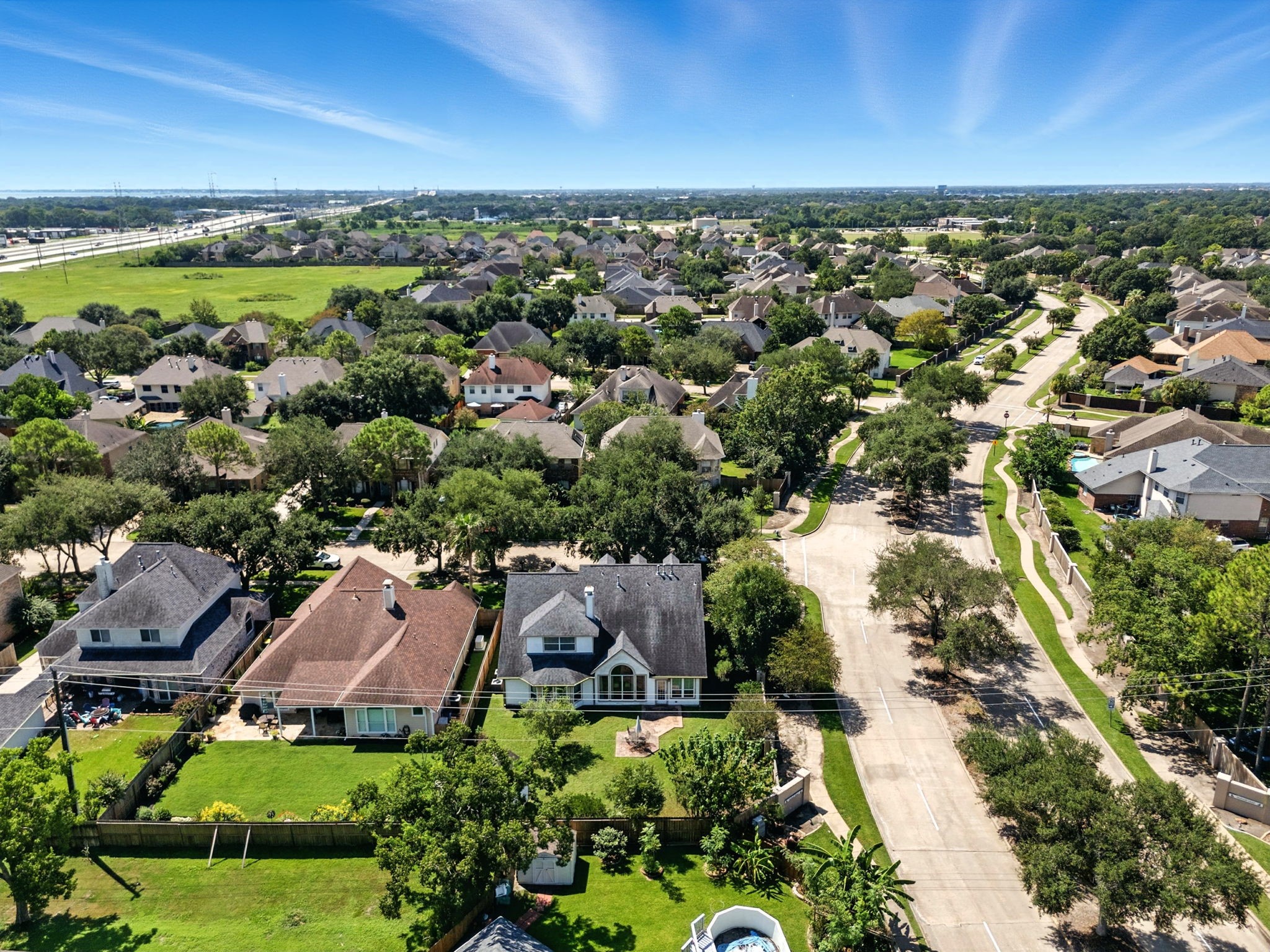 2302 Palm Circle Seabrook, TX 77586 - Photo 35 of 35 an aerial view of a city with lots of residential buildings ocean and mountain view in back