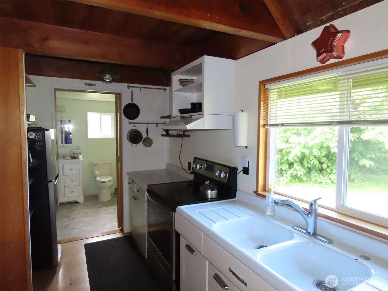 845 Schmid Road Grayland, WA 98547 - Photo 13 of 34 a kitchen with a sink stove and refrigerator