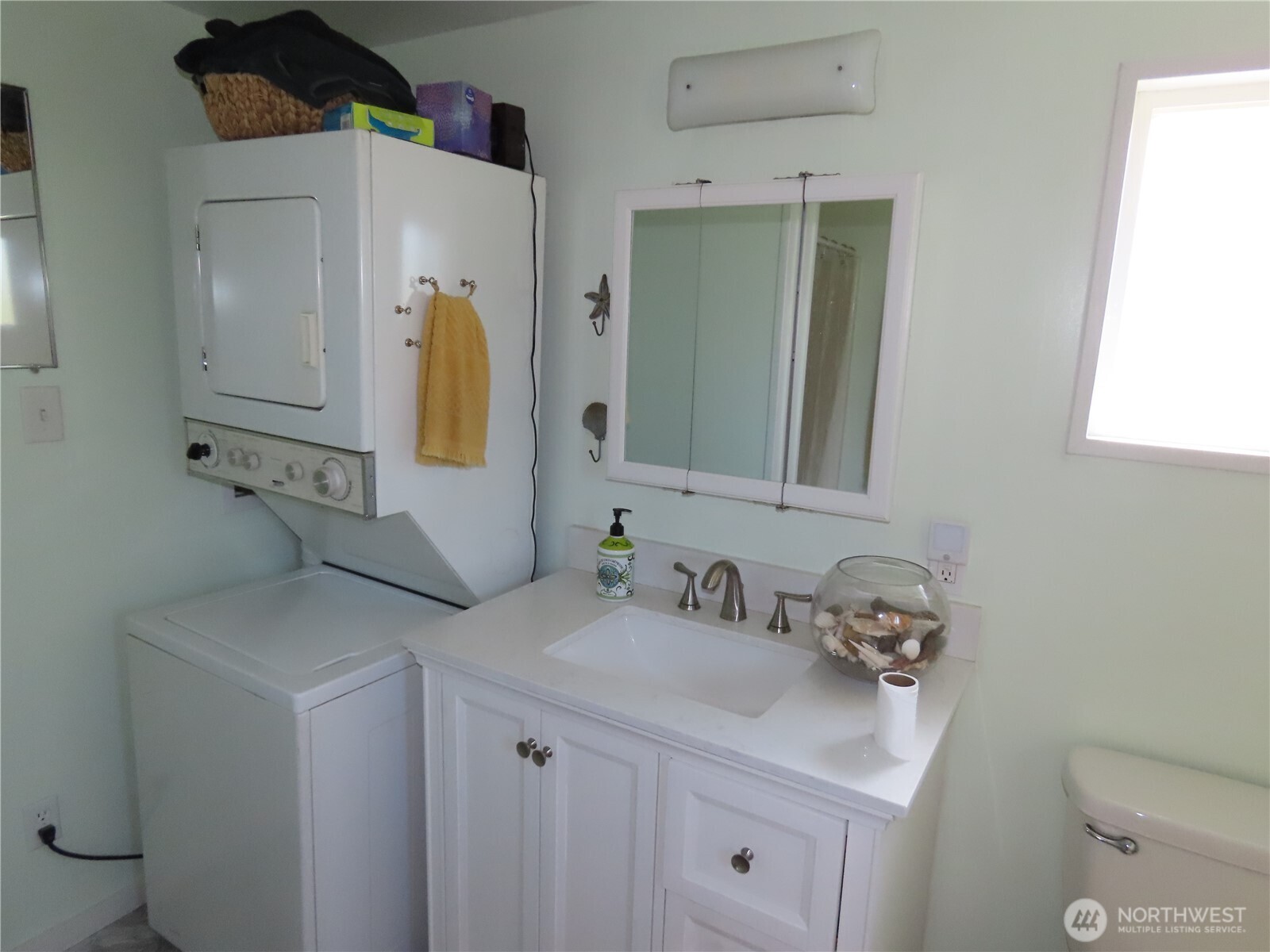 845 Schmid Road Grayland, WA 98547 - Photo 14 of 34 a bathroom with a sink toilet and mirror