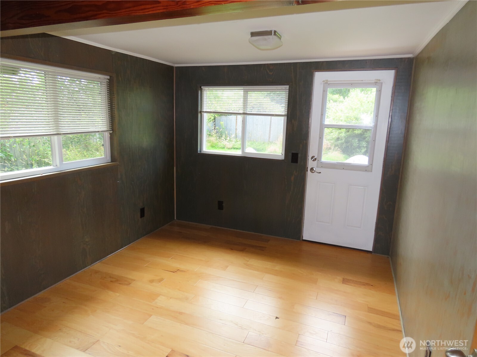 845 Schmid Road Grayland, WA 98547 - Photo 16 of 34 a view of empty room with wooden floor and fan