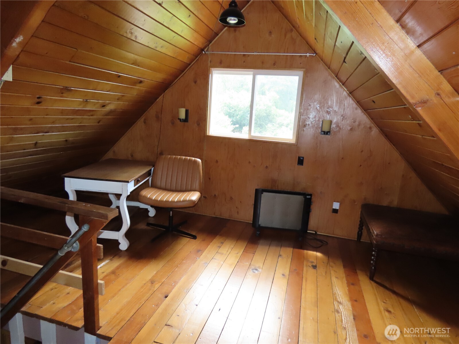 845 Schmid Road Grayland, WA 98547 - Photo 20 of 34 a room with wooden floor and furniture