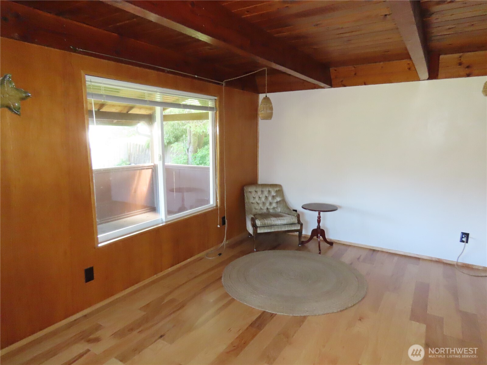 845 Schmid Road Grayland, WA 98547 - Photo 22 of 34 a room with wooden floor and a window