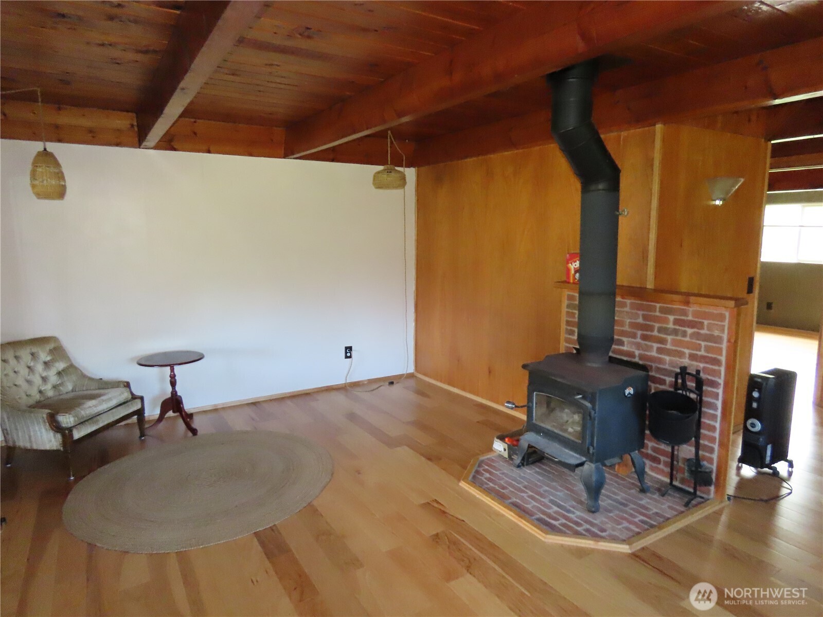 845 Schmid Road Grayland, WA 98547 - Photo 23 of 34 a living room with furniture and a fireplace