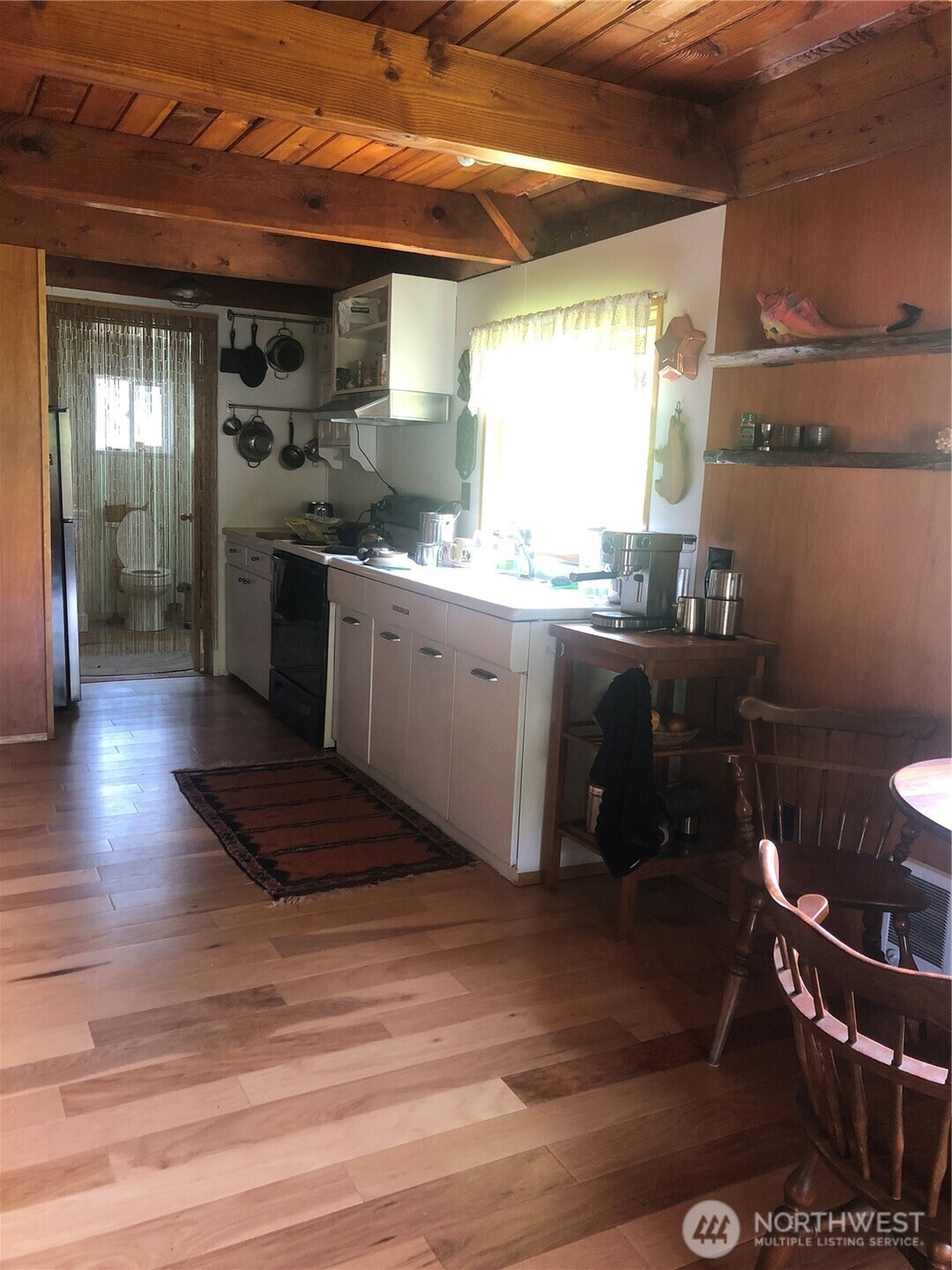 845 Schmid Road Grayland, WA 98547 - Photo 29 of 34 a kitchen with granite countertop a sink and a stove