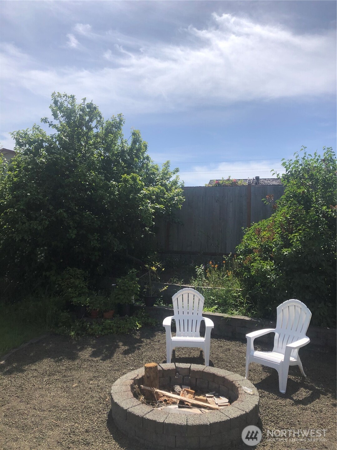845 Schmid Road Grayland, WA 98547 - Photo 31 of 34 a backyard of a house with table and chairs