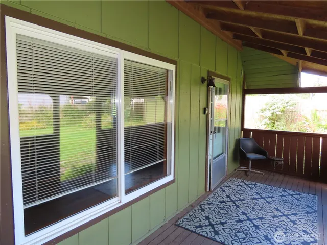 a view of a door and a window
