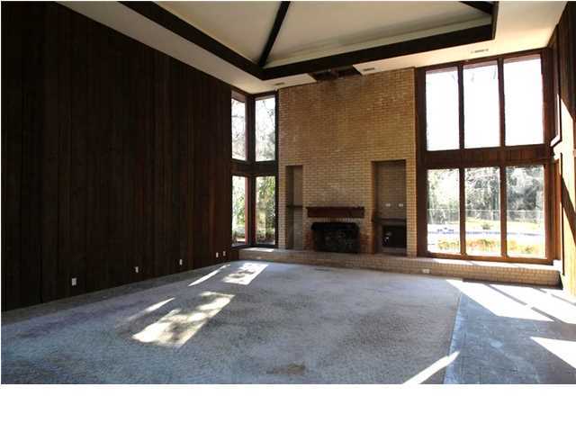 1500 Preservation Path Baker, FL 32531 - Photo 16 of 20 a living room with a large window and a fireplace