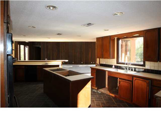 1500 Preservation Path Baker, FL 32531 - Photo 4 of 20 a kitchen with a sink and cabinets