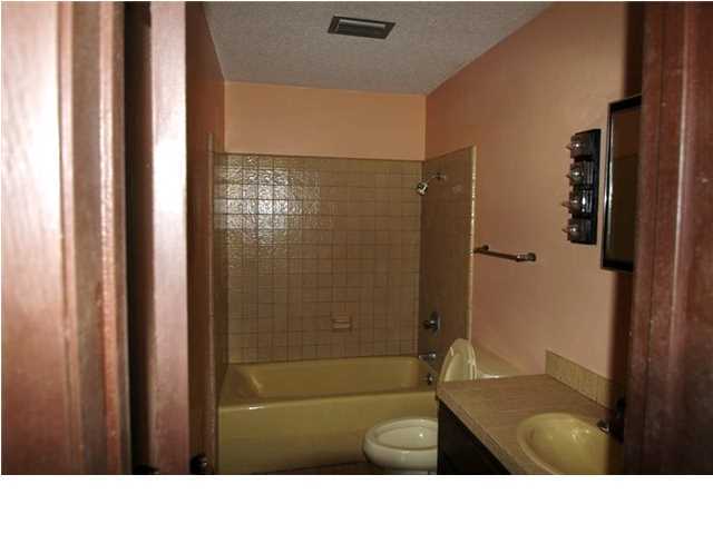1500 Preservation Path Baker, FL 32531 - Photo 8 of 20 a bathroom with a sink a toilet a shower and mirror
