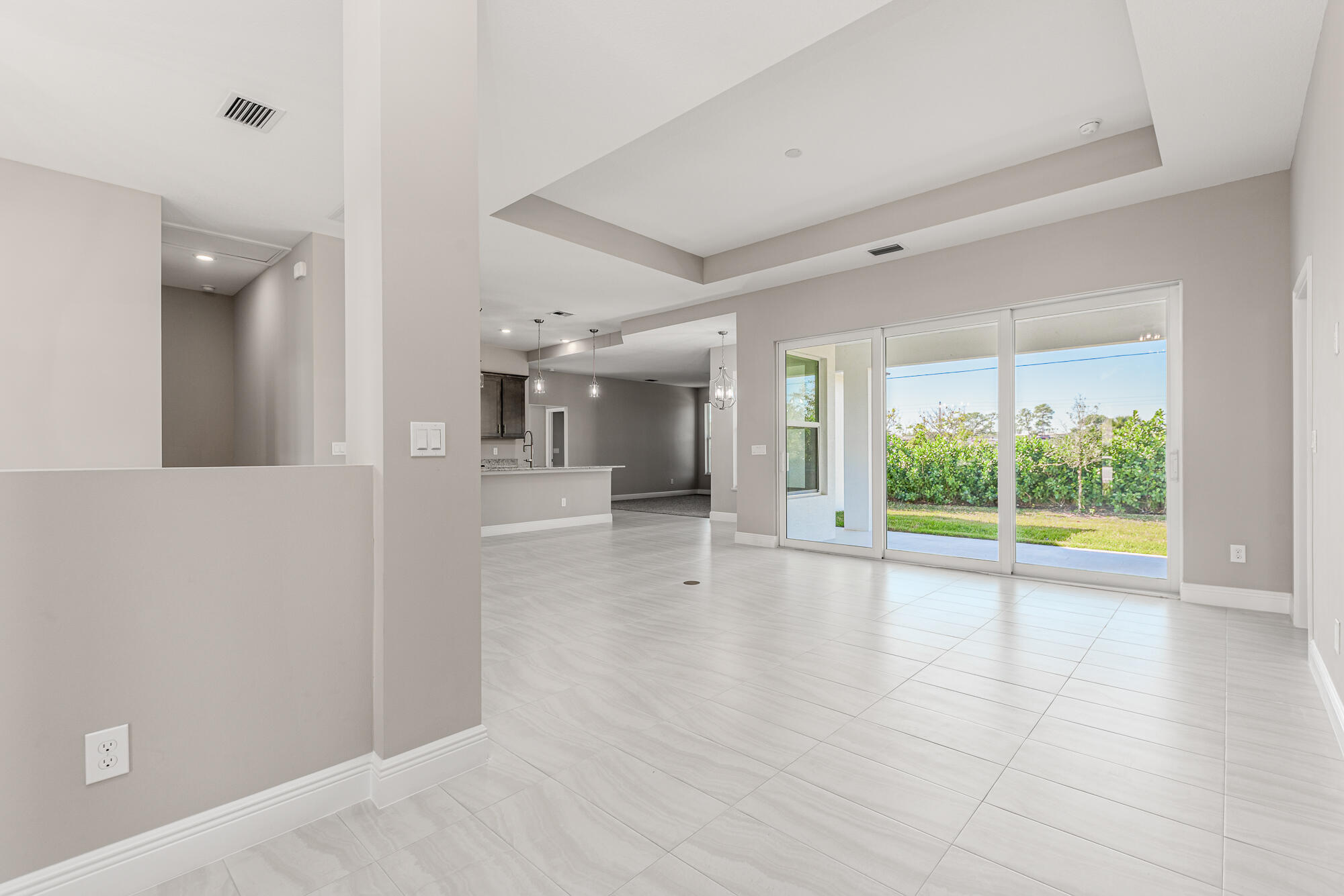 3972 Southeast Fairway West Stuart, FL 34997 - Photo 17 of 52 wooden floor in an empty room with a window