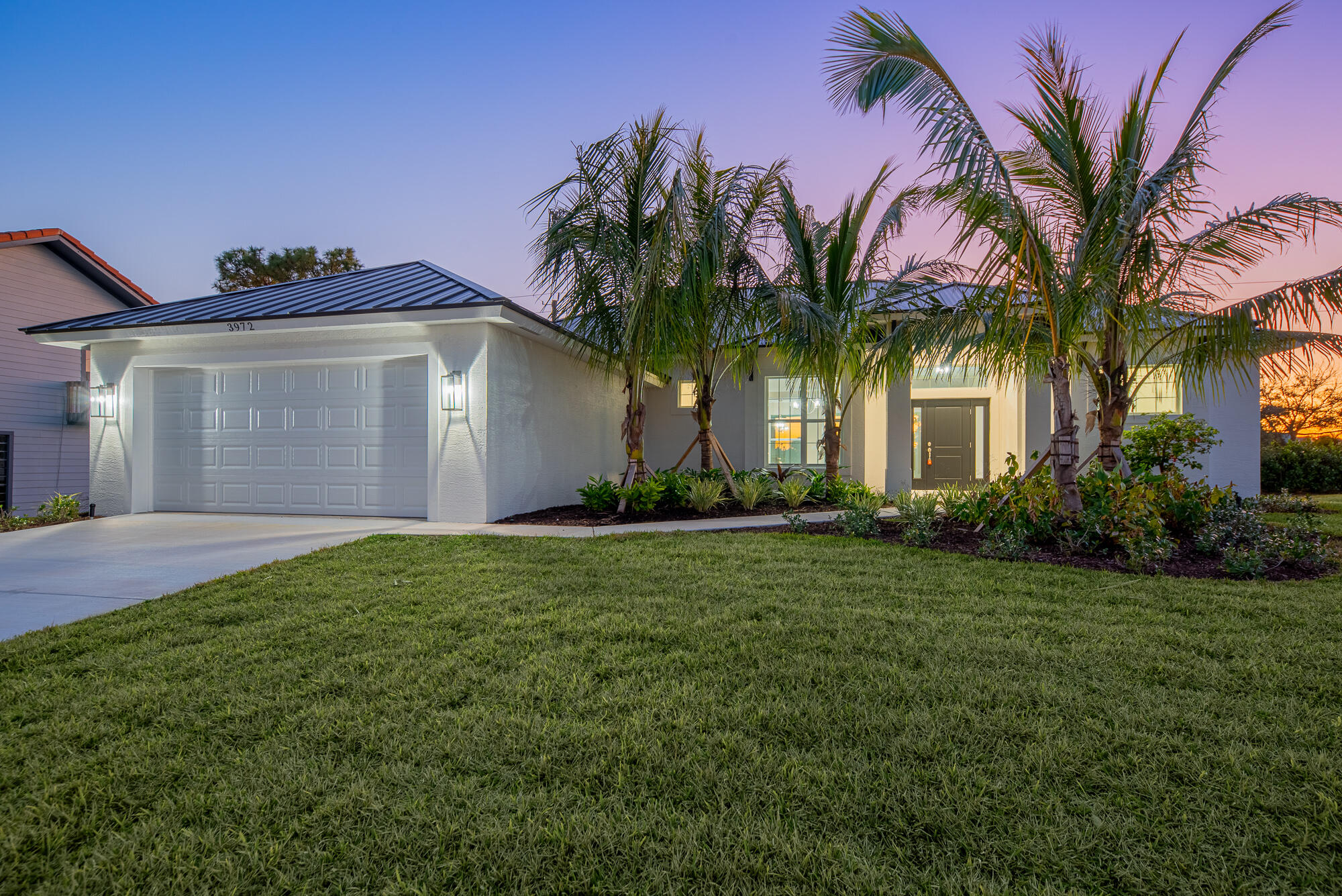 3972 Southeast Fairway West Stuart, FL 34997 - Photo 2 of 52 a front view of house with yard and green space