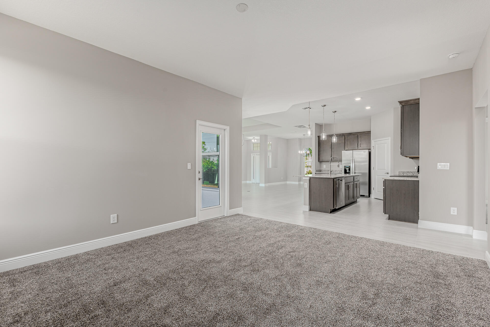 3972 Southeast Fairway West Stuart, FL 34997 - Photo 26 of 52 a view of a kitchen with a sink and a window