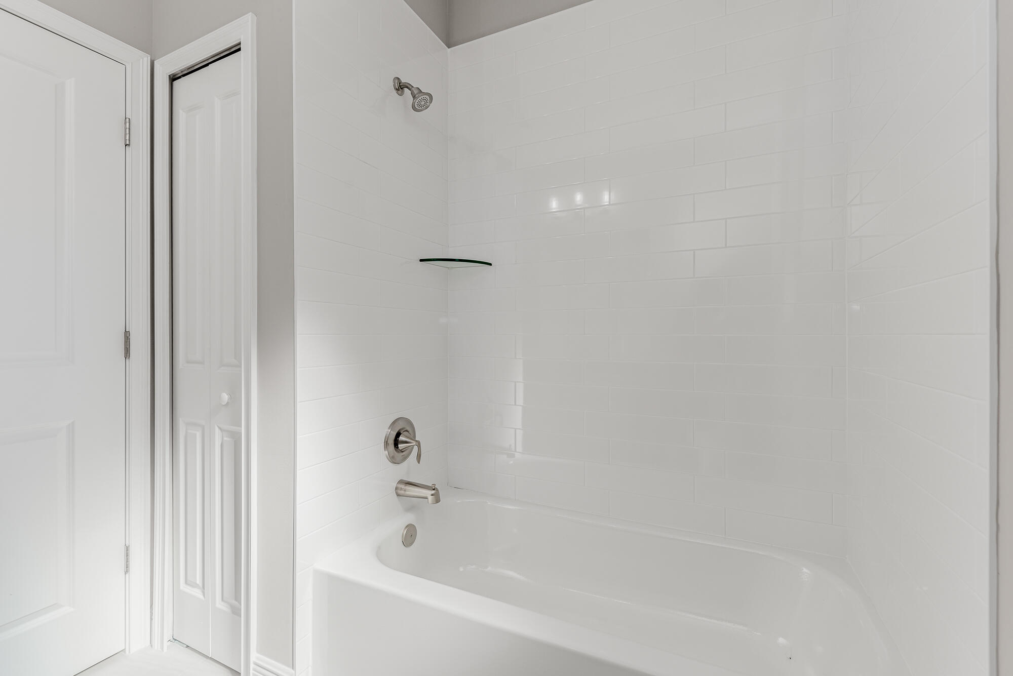 3972 Southeast Fairway West Stuart, FL 34997 - Photo 35 of 52 a white bath tub sitting next to a white wooden wall