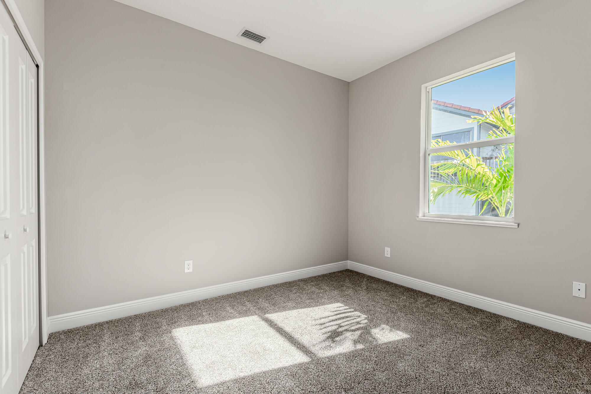 3972 Southeast Fairway West Stuart, FL 34997 - Photo 36 of 52 an empty room with a window