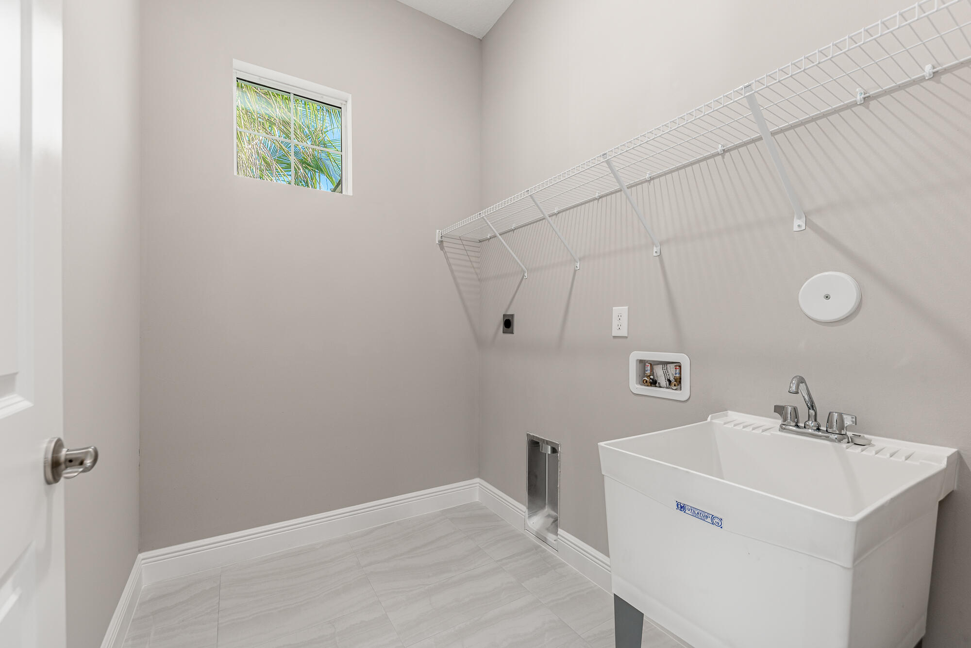 3972 Southeast Fairway West Stuart, FL 34997 - Photo 37 of 52 a bathroom with a sink a vanity and a mirror