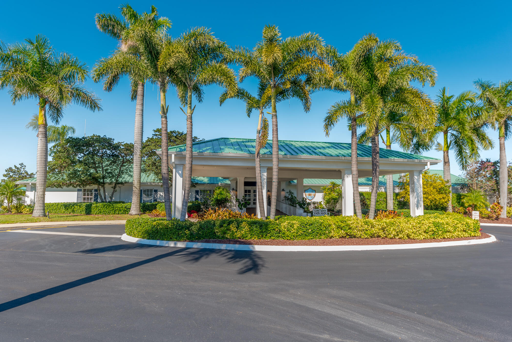 3972 Southeast Fairway West Stuart, FL 34997 - Photo 43 of 52 a front view of multi story residential apartment building with yard and green space