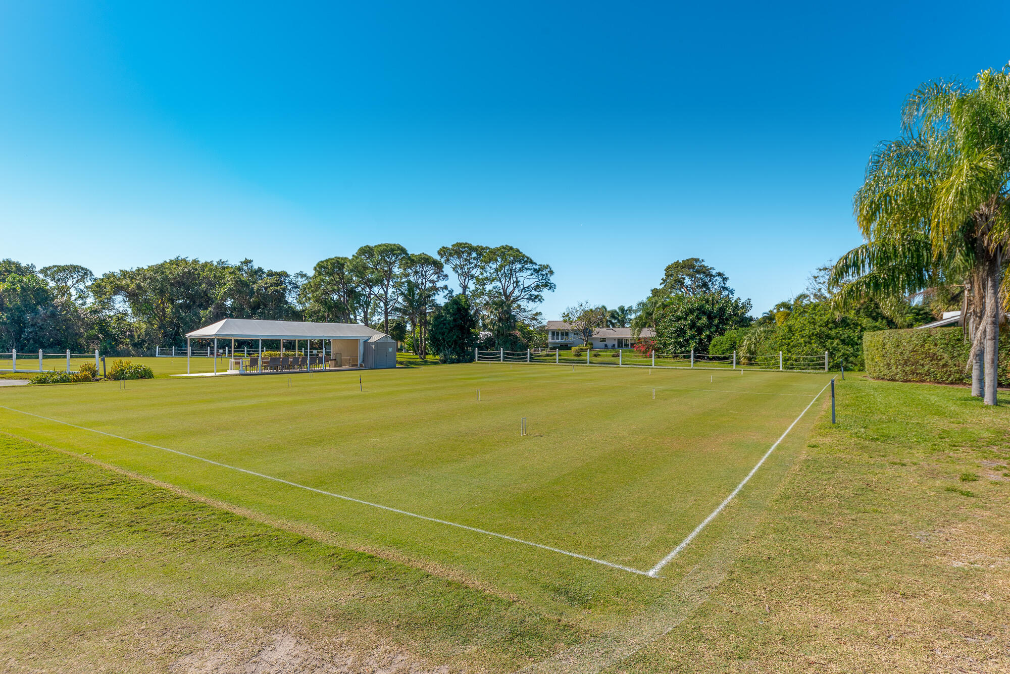 3972 Southeast Fairway West Stuart, FL 34997 - Photo 50 of 52 a view of an outdoor space and tennis court