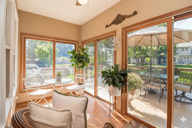 a kitchen with stainless steel appliances granite countertop a stove top oven a refrigerator a sink and dishwasher with wooden floor