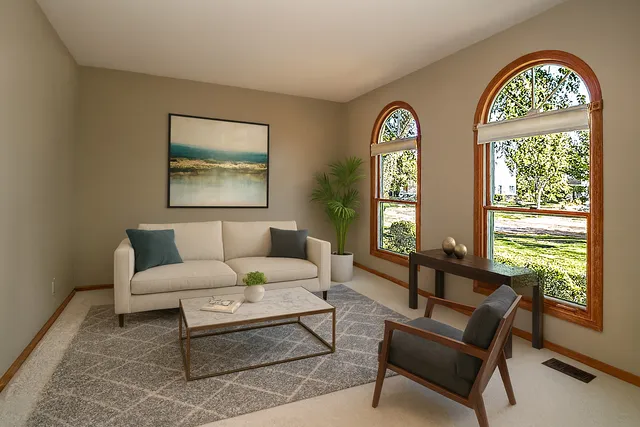 a living room with furniture and window