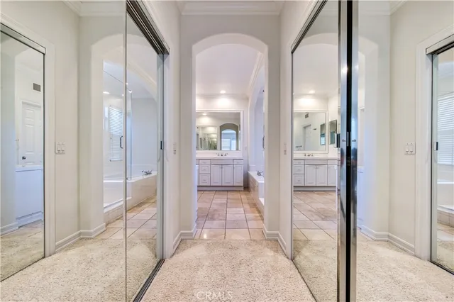 a bathroom with a bathtub shower sink and mirror