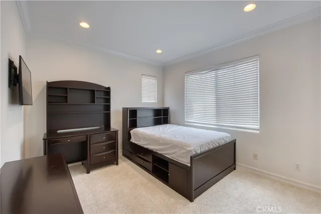 a garden with a table and a potted plant