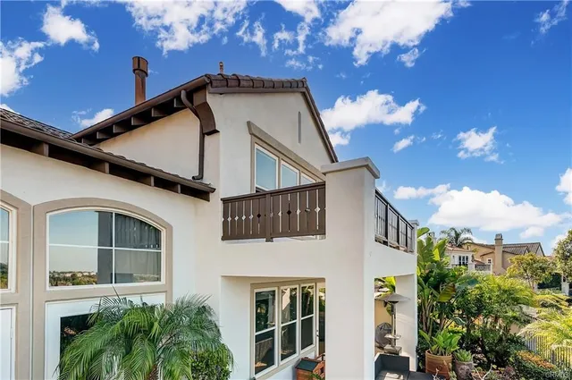 a view of a house with wooden floor and potted plants
