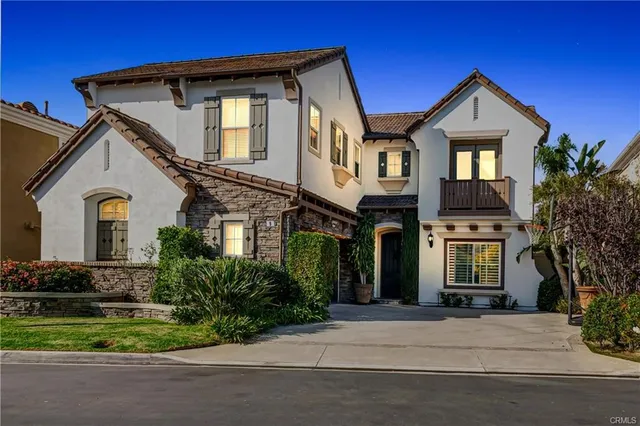 a view of a patio with couches and potted plants