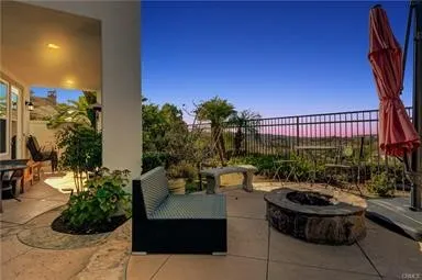 a view of a patio with couches and potted plants