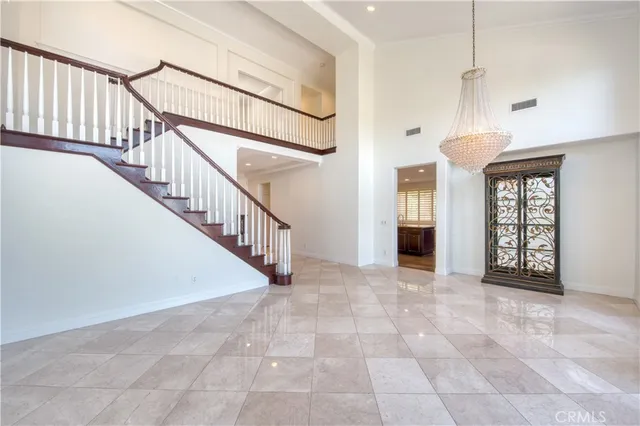 a view of entryway and hall with a front door