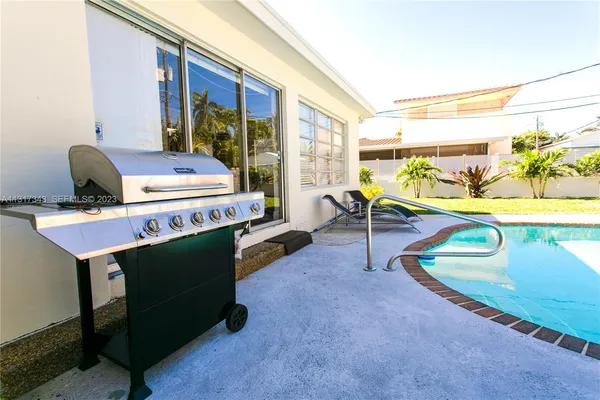a view of a chairs and table in a room