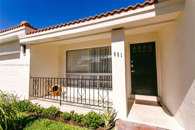 a view of a balcony with a potted plant