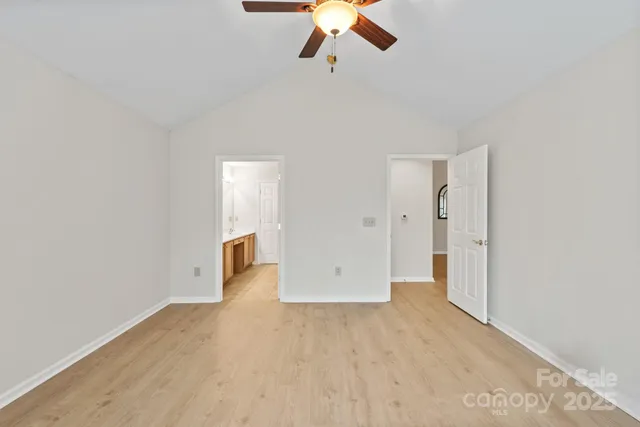 a spacious bathroom with a double vanity sink toilet and a tub